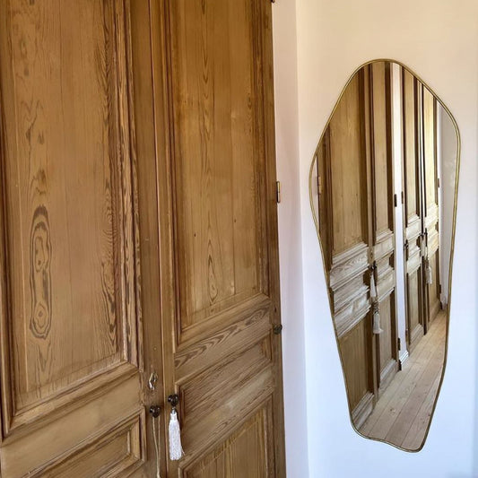 Miroir mural en laiton asymétrique